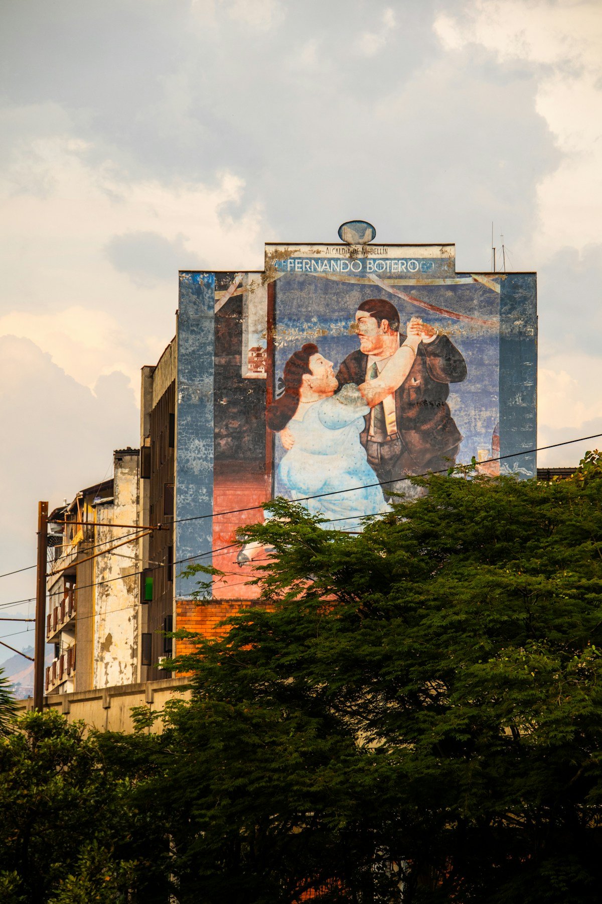 Large Fernando Botero mural on building facade, Medellin, Colombia