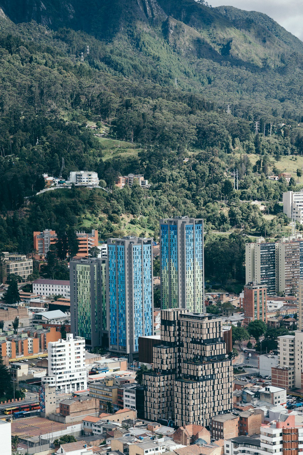 Bogota skyline with modern towers and the Andes mountains rising behind the city