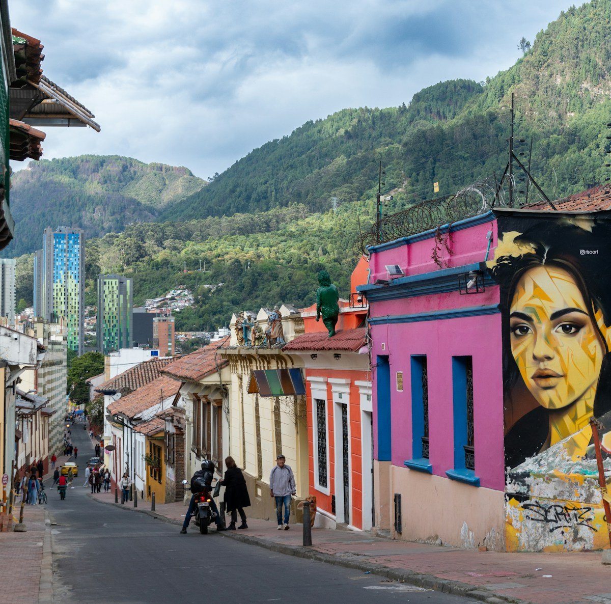 Colourful street art murals covering building facades in Bogota, Colombia