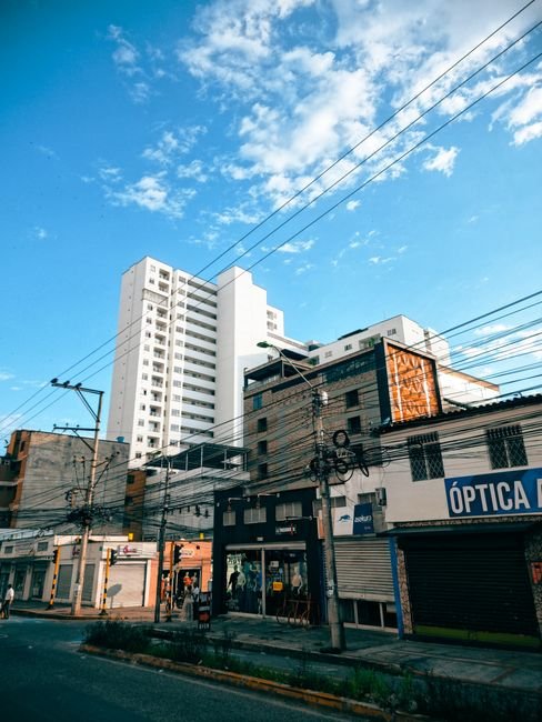Bucaramanga city street with Metrolínea bus and pedestrians in the El Prado district