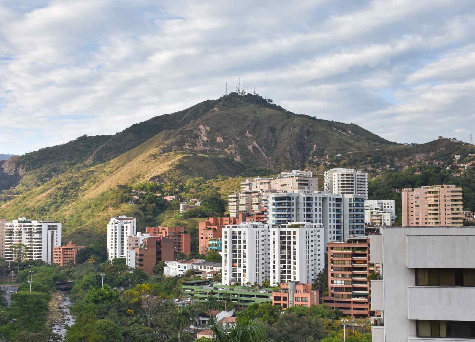 Residential high-rises in Cali with the Andean hills rising behind the city, Colombia