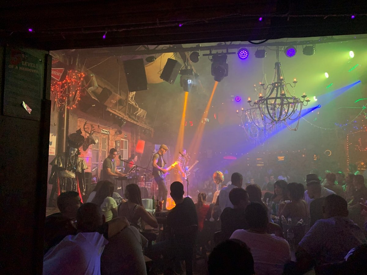 A crowd gathering at a live music concert at night in Cali, Colombia