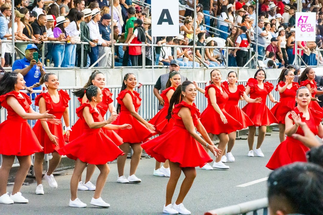 Dancers in red dresses performing at the Feria de Cali, the world's largest salsa festival
