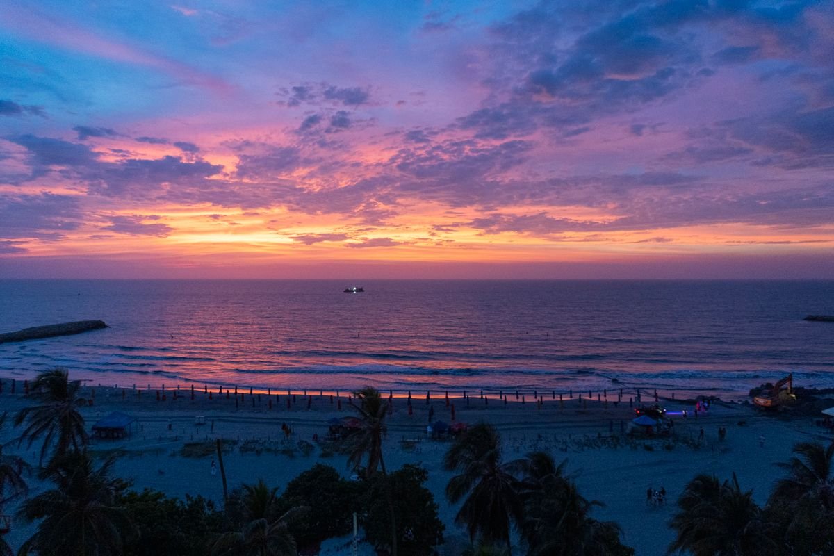 Pink and purple sunset sky over the Caribbean from a Cartagena beach