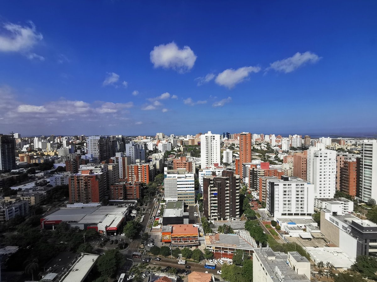 Barranquilla city skyline with buildings under a blue Caribbean sky