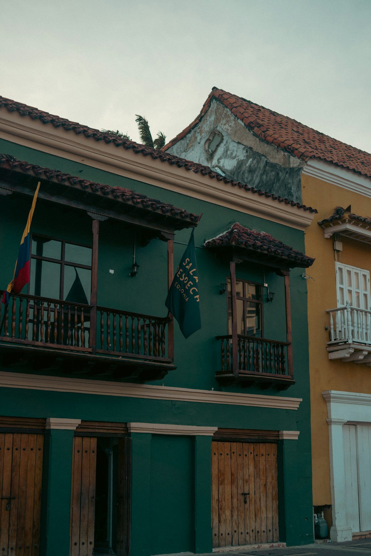 Colourful colonial buildings lining a cobblestone street in Cartagena's walled city