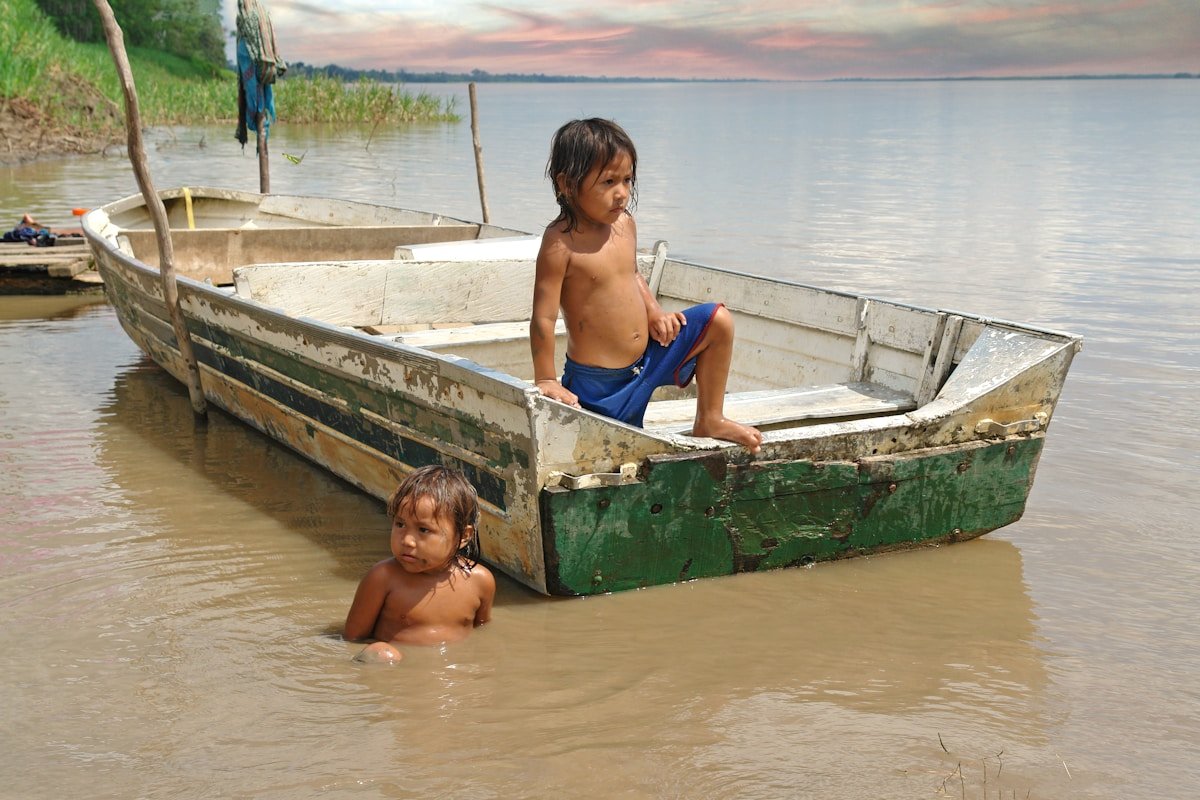 The Amazon river at Leticia with dense jungle reaching to the water's edge