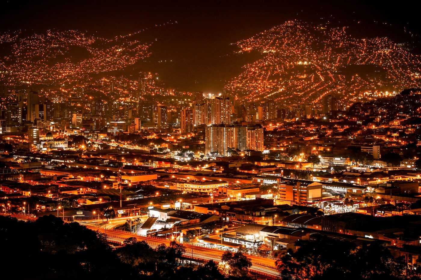 Medellin city illuminated with golden Christmas Alumbrado lights at night, Colombia