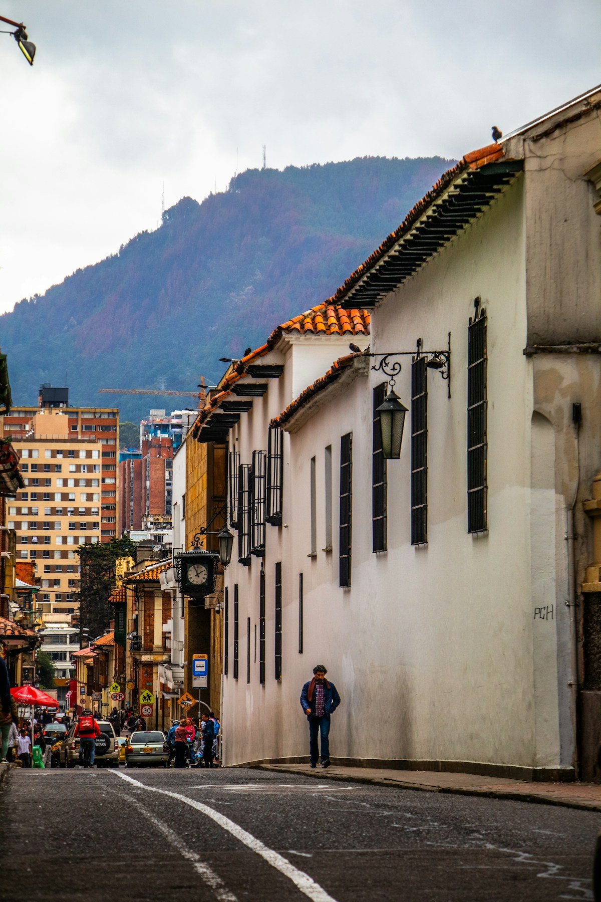 La Candelaria street in Bogota with colonial architecture and Monserrate hill in the background
