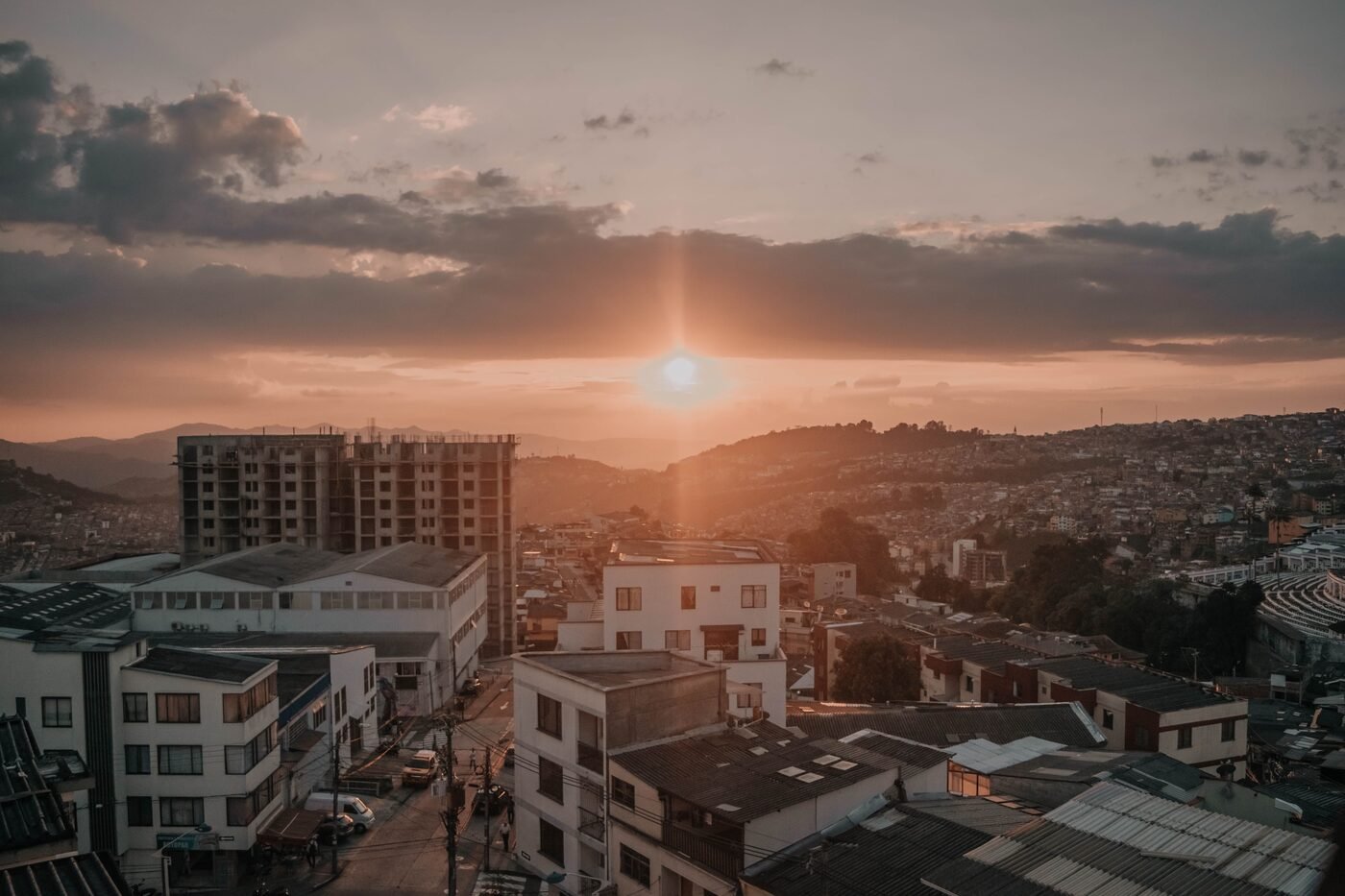 Golden sunset over the rooftops and hillside neighbourhoods of Manizales, Colombia
