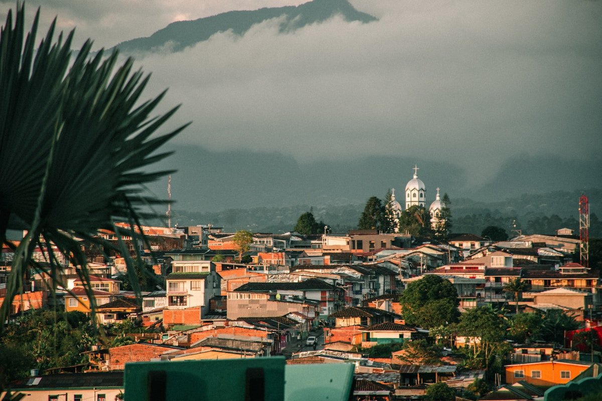 View of Filandia town with green mountain backdrop, Quindio, Colombia
