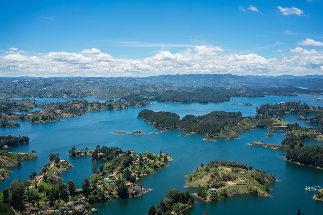 View from La Piedra del Peñol over the Embalse Guatapé reservoir, with islands and forested hills stretching to the horizon