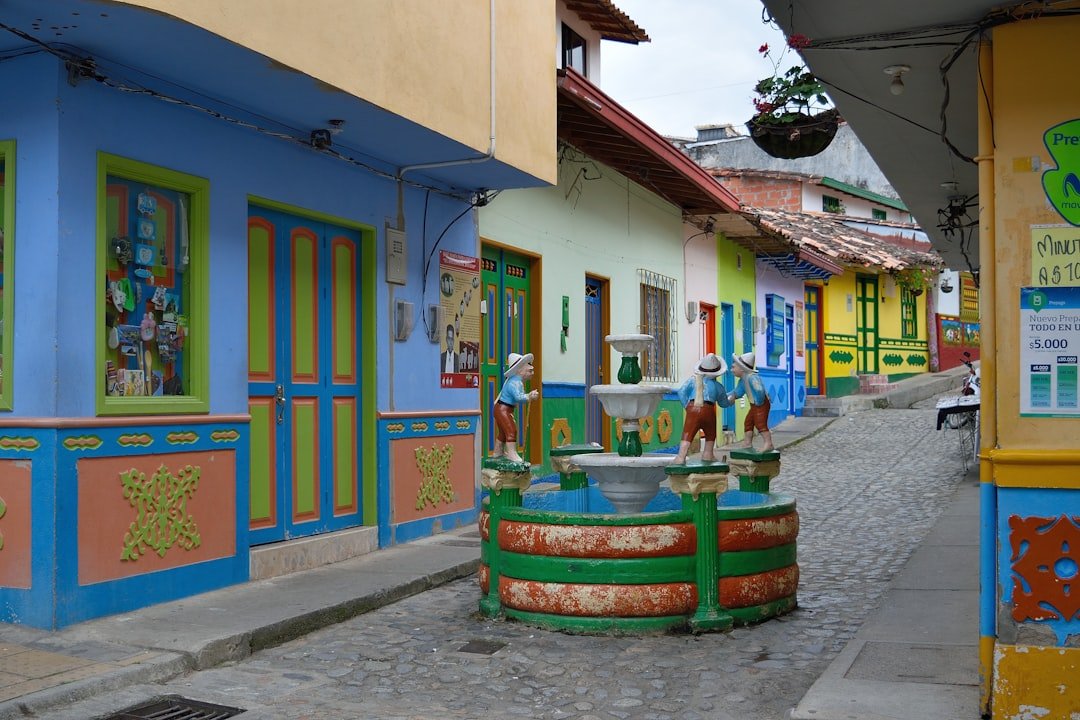 Colourful painted facades of guesthouses along a street in Guatapé, Antioquia, Colombia