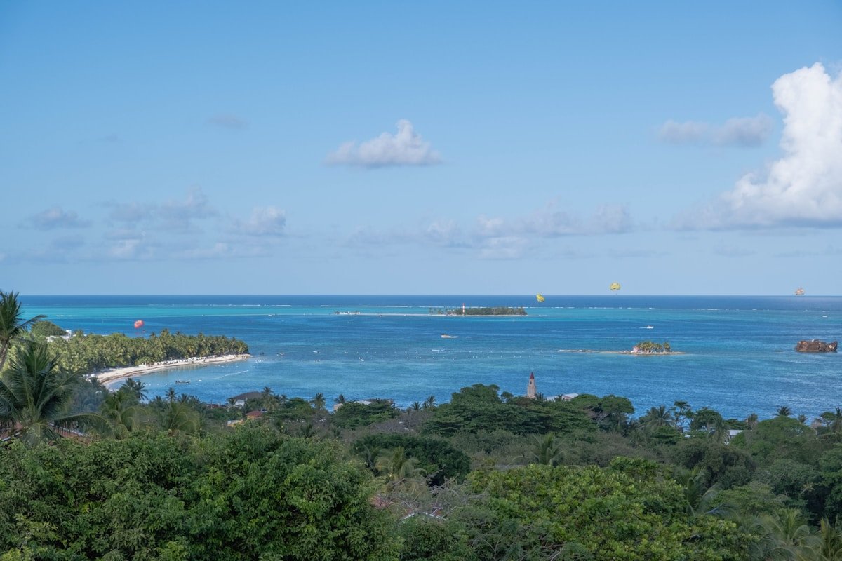 Lush green hills sloping down to clear turquoise ocean on San Andres island, Colombia