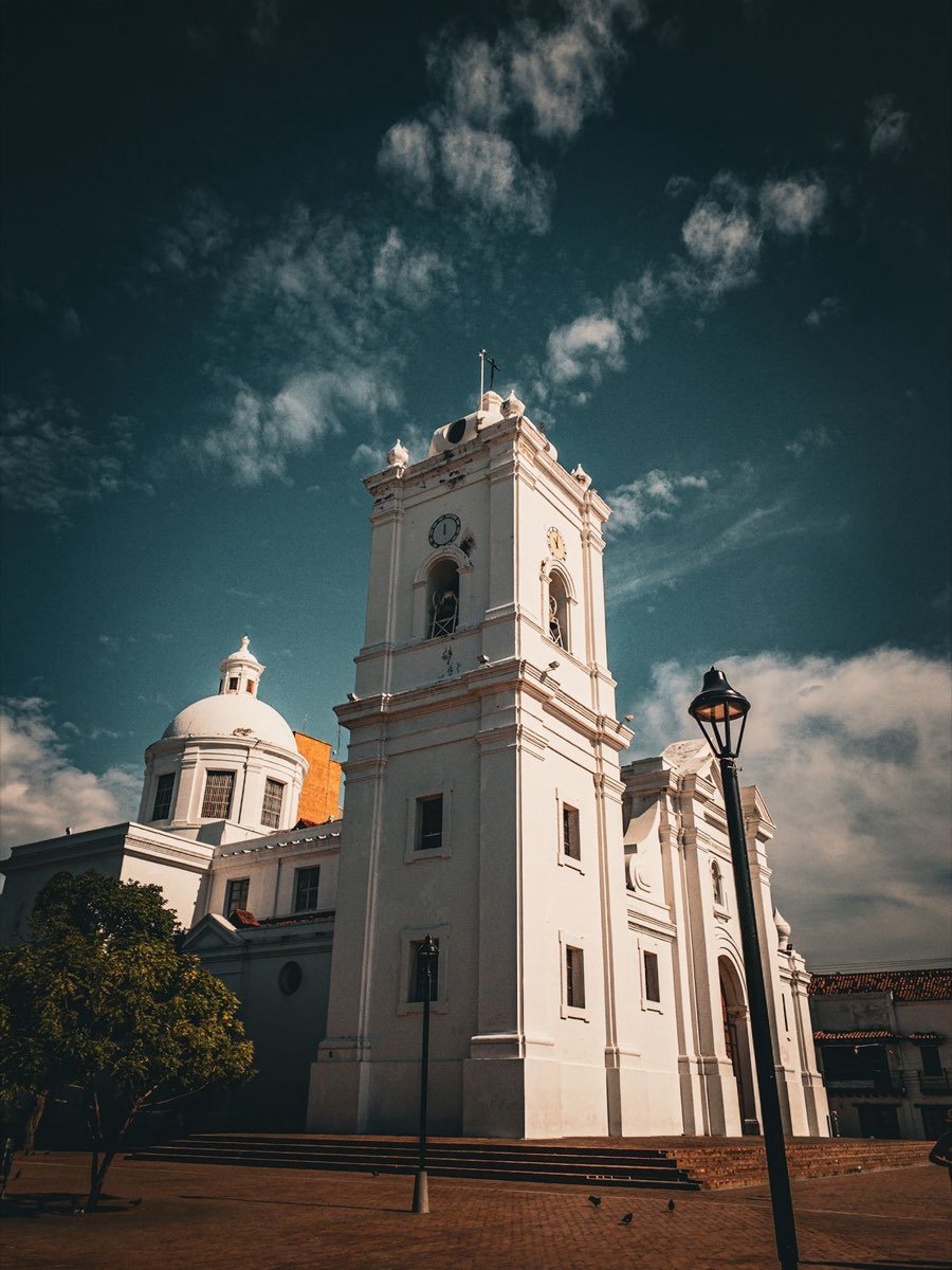 White cathedral with clock tower in Santa Marta