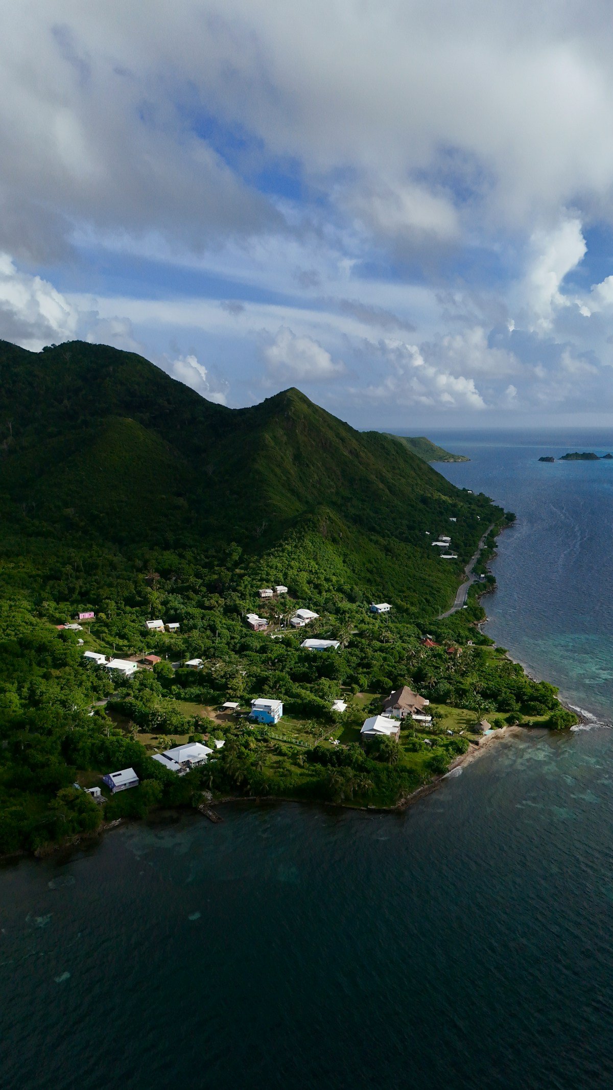 Aerial view of Providencia Island showing lush green mountains and turquoise Caribbean sea