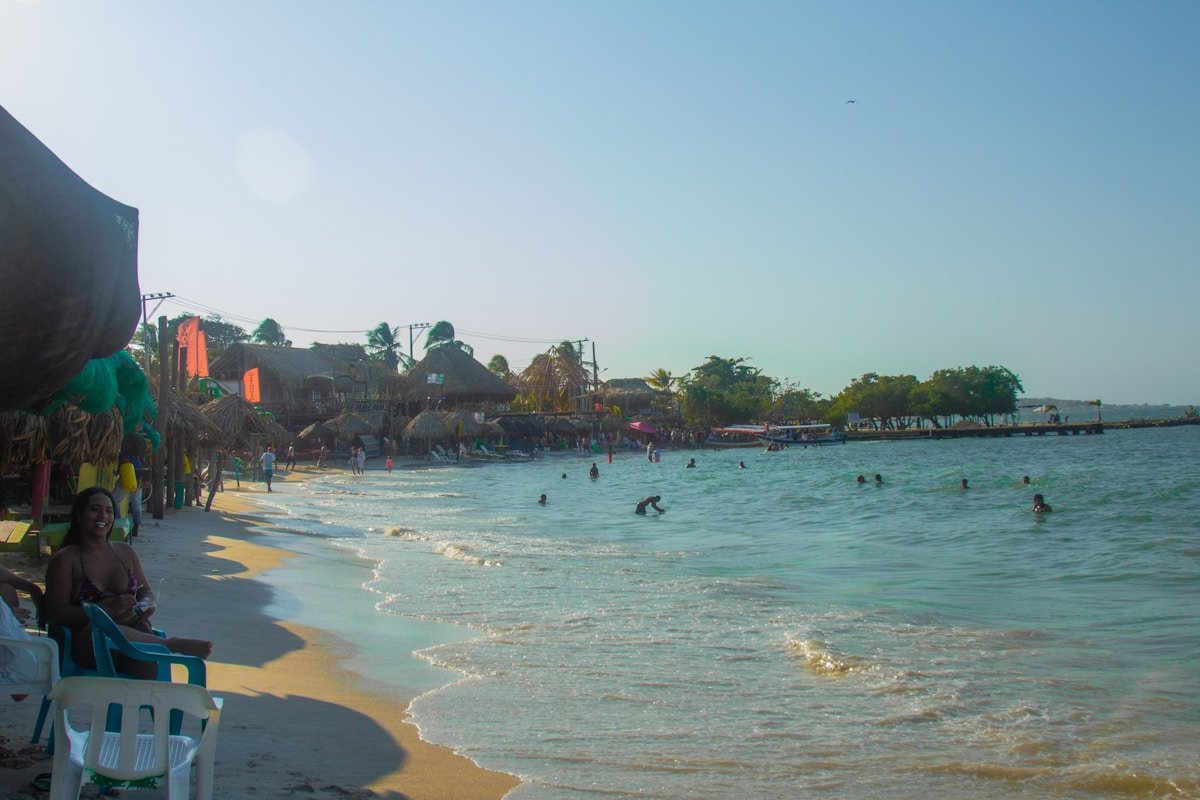 People swimming in turquoise water at the Rosario Islands, Colombia