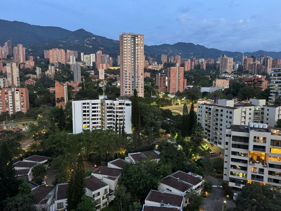 Evening view over El Poblado, Medellín, with apartment towers and green hills