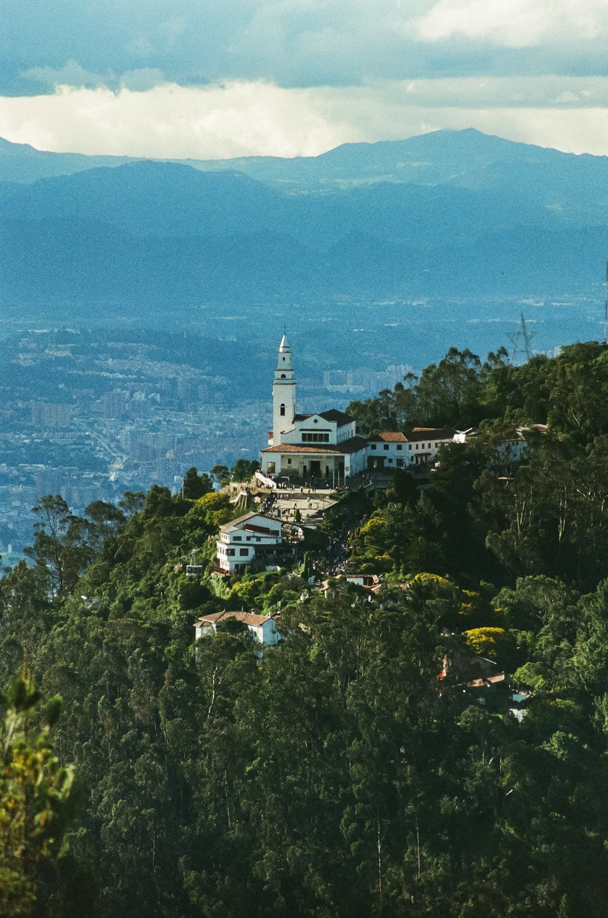 Monserrate sanctuary on its wooded hill above Bogota with the city and Andes mountains behind