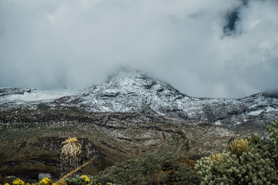 Steam rising from the active Puracé volcano crater above cloud forest, Cauca department, Colombia