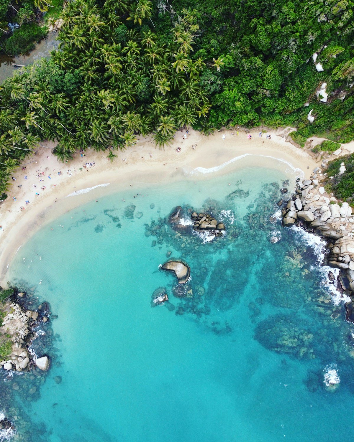 Aerial view of a sandy beach and turquoise Caribbean water at Santa Marta, Colombia