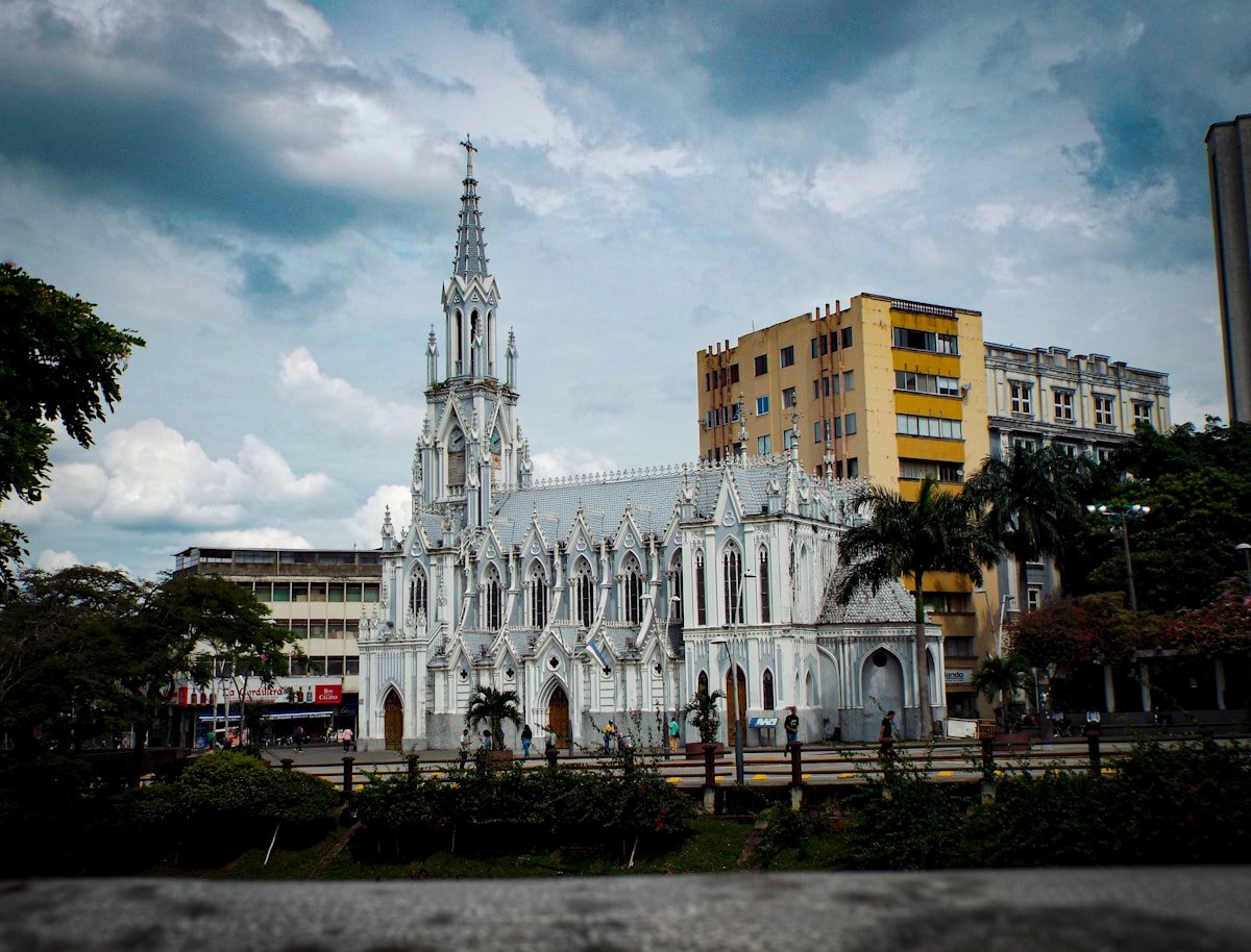 La Ermita Gothic church with white spire rising above the city streets of Cali, Valle del Cauca, Colombia